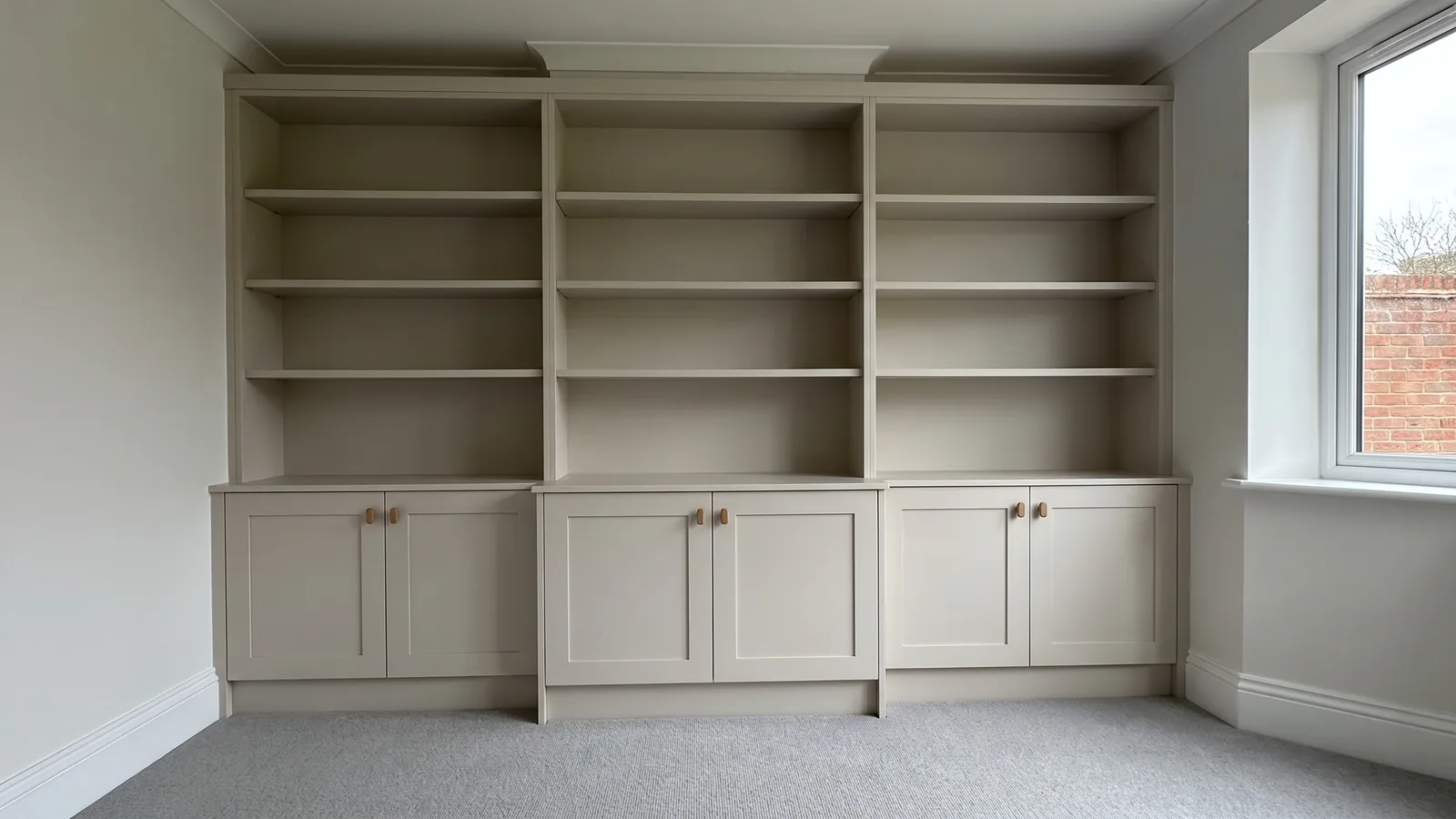 Tall charcoal painted bookcase with six shelves before fitting