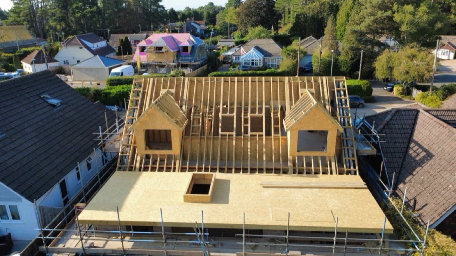 Aerial view of a loft conversion roof frame with twin dormers under construction