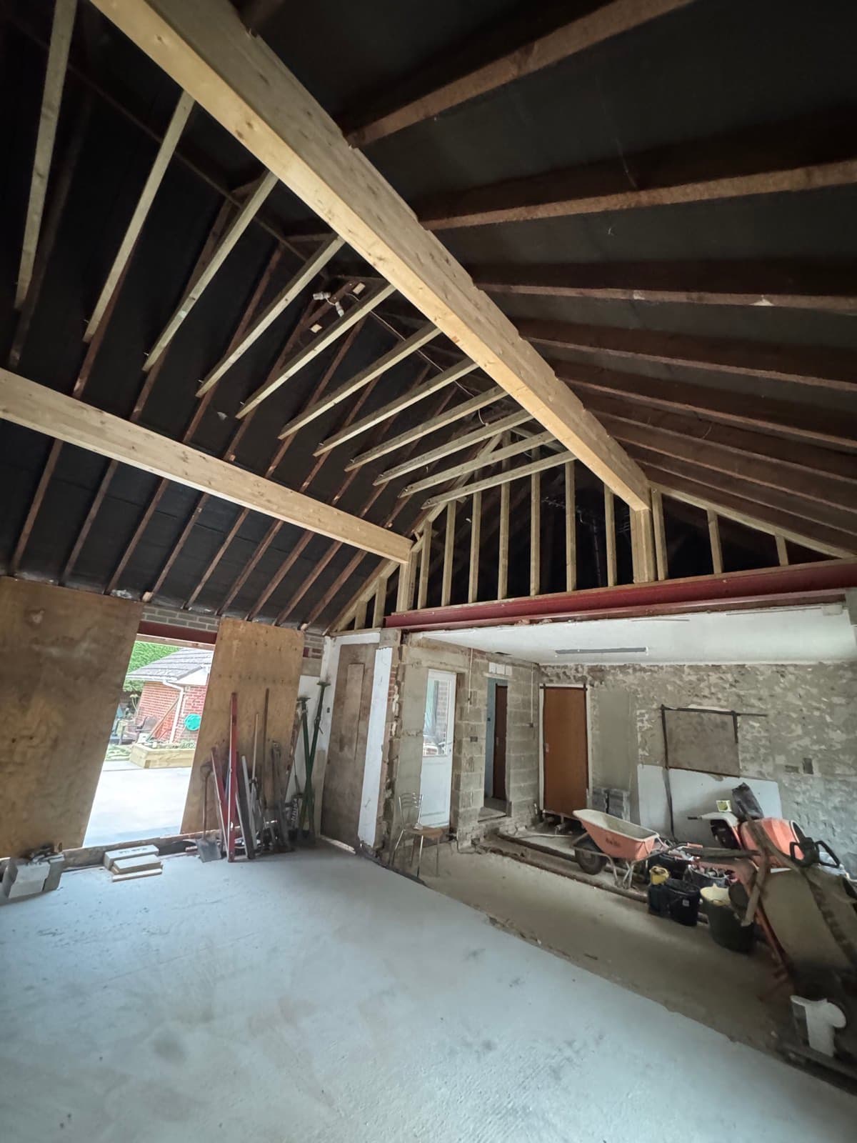 New timber roof rafters and beam under construction in a renovated outbuilding