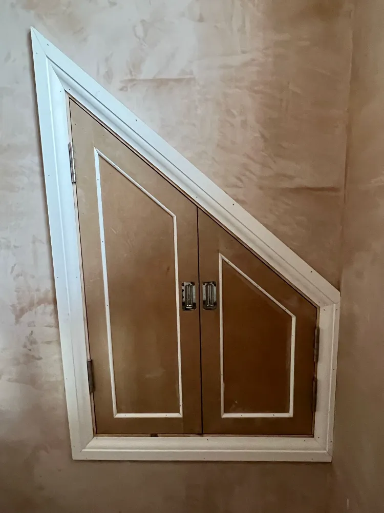 Close-up of a mortice latch fitted into a new light oak internal door edge